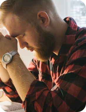 a man and a woman are praying