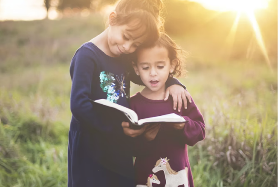 two girls are reading